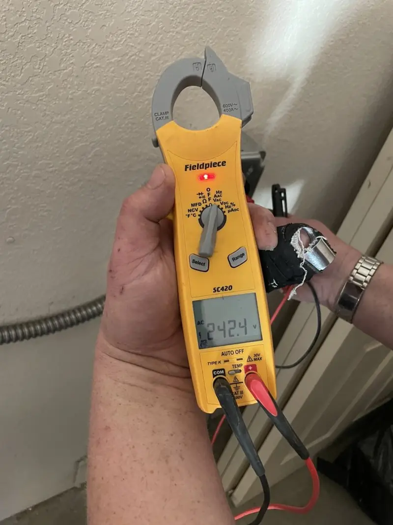 Voltage testing with clamp meter during Electrical Installation Services in Four Corners